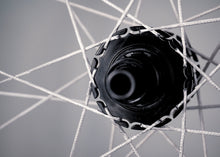 Load image into Gallery viewer, Up Close Shot of Berd Spokes Laced to Talon Hook Flange Hub 